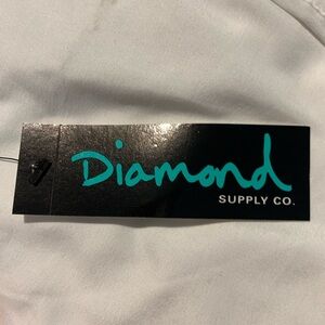 Red T shirt with Barbed  wired lines and Diamond across the chest